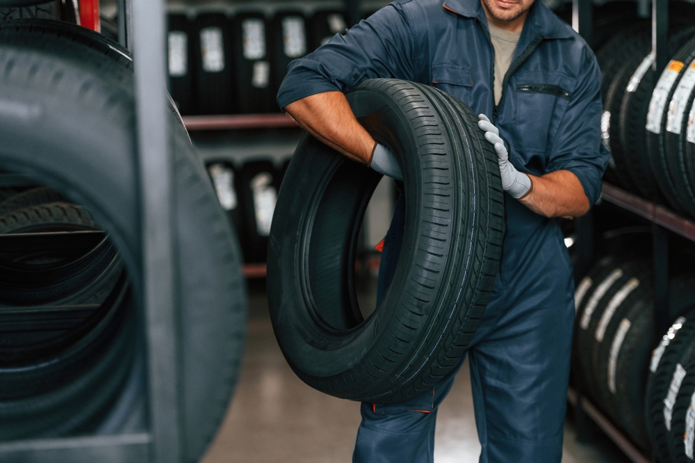 technician with a tire