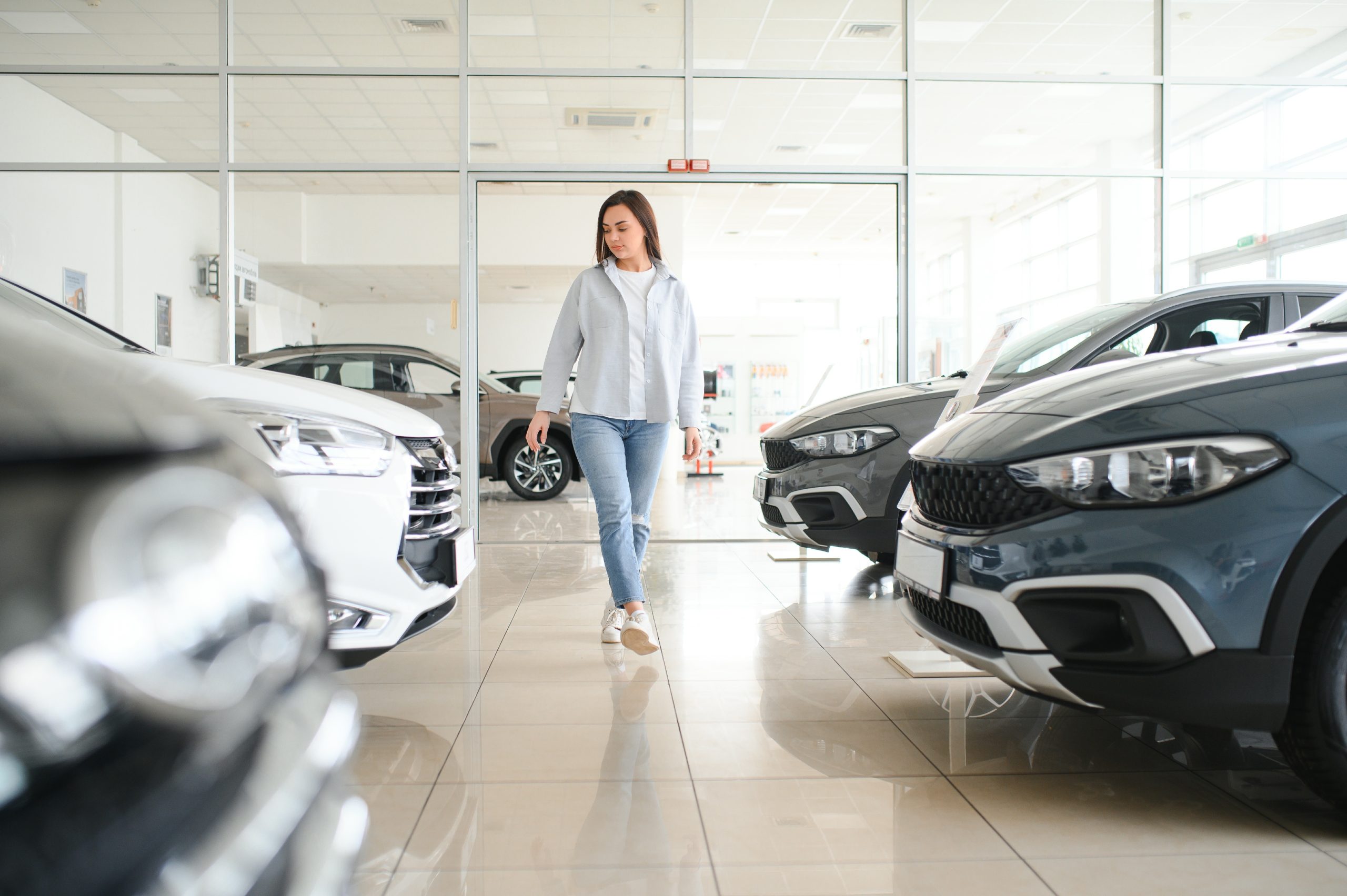 woman looking at cars